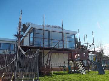 Mr & Mrs D. Colwyn Bay, North Wales : Installation of Internorm Alu Clad windows Glazed with 48mm triple glazed units fabricated from 3 no 6mm toughened panals U value .5